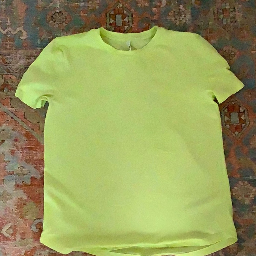 This is a lululemon lime colored shirt.